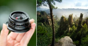A hand holds a camera lens on the left, while the right side shows a scenic view of tall, rocky forested mountains under a cloudy sky, with pine trees in the foreground.