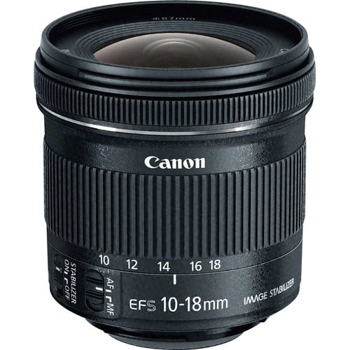 Canon EFS 10-18mm camera lens with image stabilizer, featuring a zoom ring, focus ring, and image stabilization switch, photographed against a plain white background.
