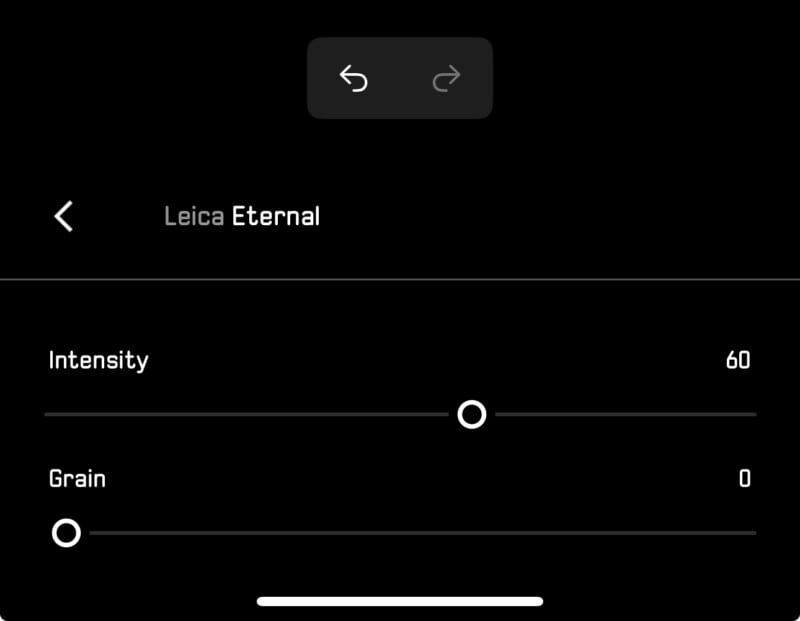 Screenshot of a photo editing app showing the "Leica Eternal" filter with Intensity set to 60 and Grain set to 0. A back arrow and undo/redo buttons are visible at the top.