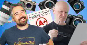 Two men appear against a blue background with digital cameras, lenses, and a report card showing an A+ floating around them. One man smiles confidently, while the other looks thoughtfully at a tablet.