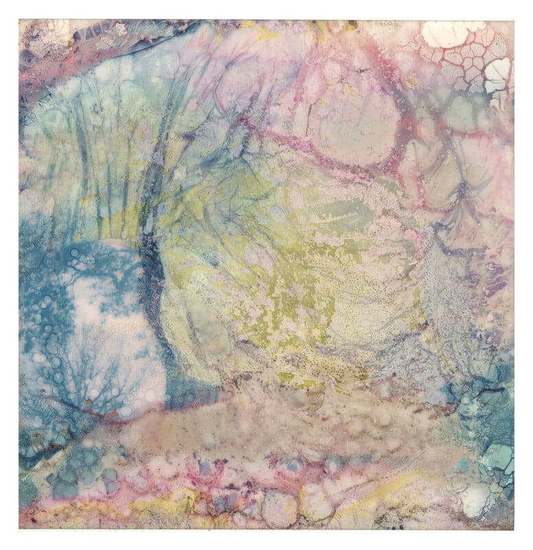Abstract artwork featuring soft, pastel colors with swirling patterns of blue, pink, yellow, and purple; textured areas and faint bubble-like shapes create a dreamy, watercolor-like effect.