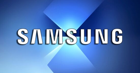 Samsung logo in bold white letters with black shadows, centered on a blue gradient background featuring intersecting light beams and geometric shapes.